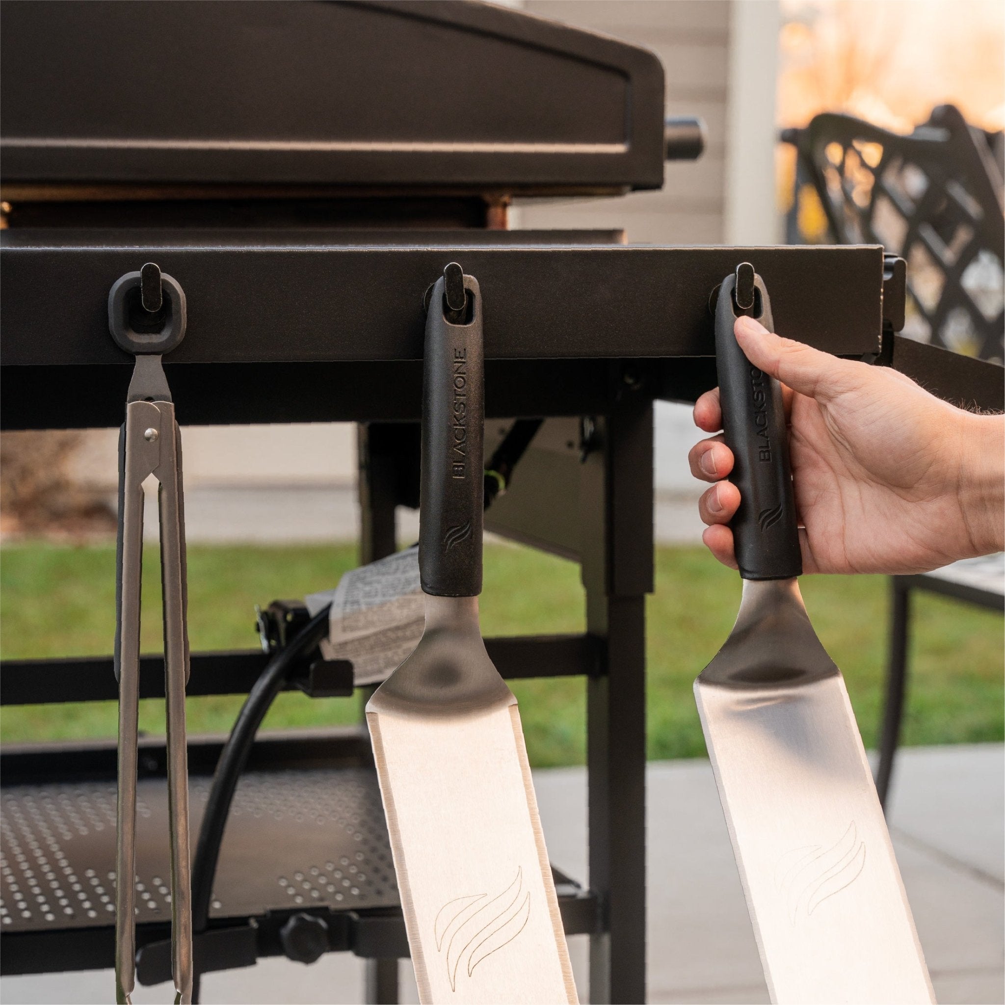Use the side shelf hooks to hold your griddle tools.