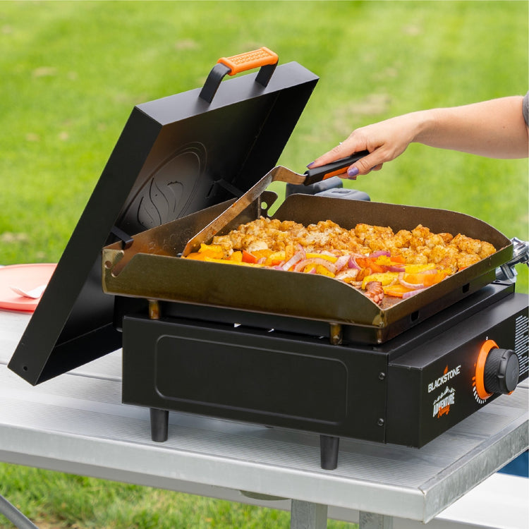 The durable hard cover protects your griddle plate and hangs off the back of the griddle when not in use. 