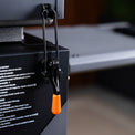 The securing hood latch keeps the hood secure during travel. 