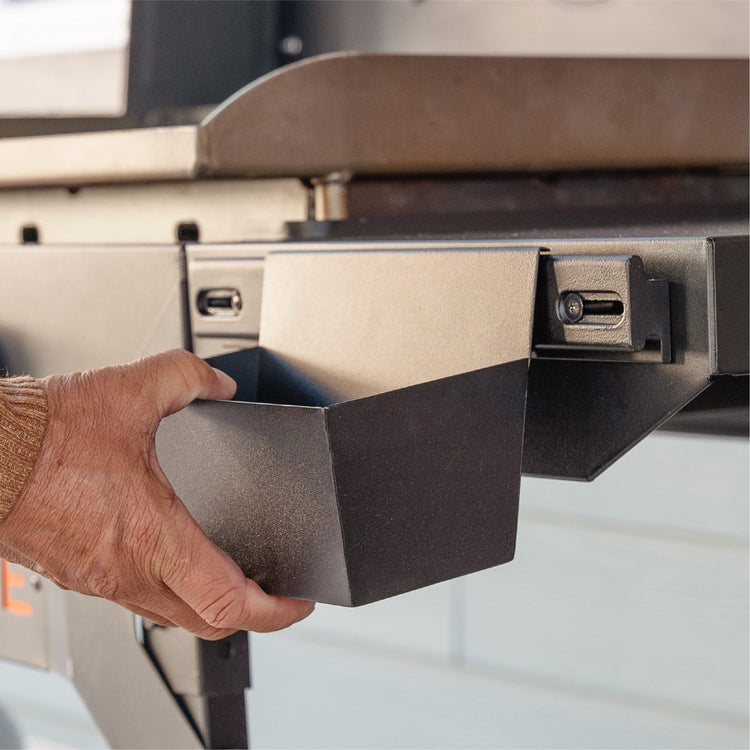 The included accessory bin is perfect for holding your seasoning bottles or other accessories. 