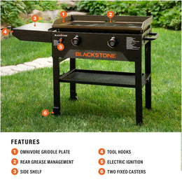 The griddle features an Omnivore Griddle Plate, Rear Grease Management, side shelf, tool hooks, electric push-button ignition, and two fixed caster wheels. 