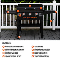 The griddle features Omnivore Griddle Plate, Rear Grease Management, a protective hood, magnetic toolbar, tool hooks, paper tool holder, electric ignition, and two fixed caster wheels. 