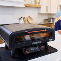 The double-paned glass door keeps the heat in to cook the pizza fast. 