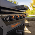 The 'X' brace hood protects the griddle plate when not in use. 