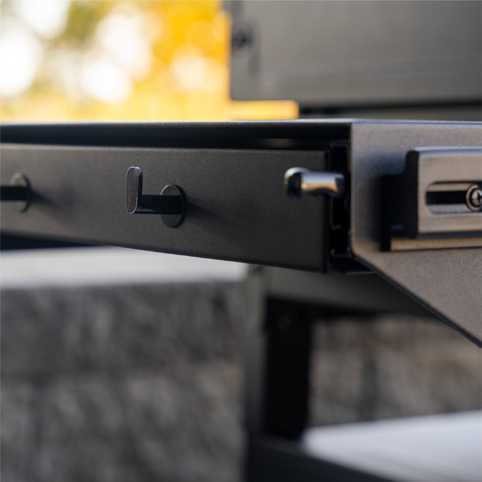 The side shelf hooks are perfect for holding your griddle gear. 