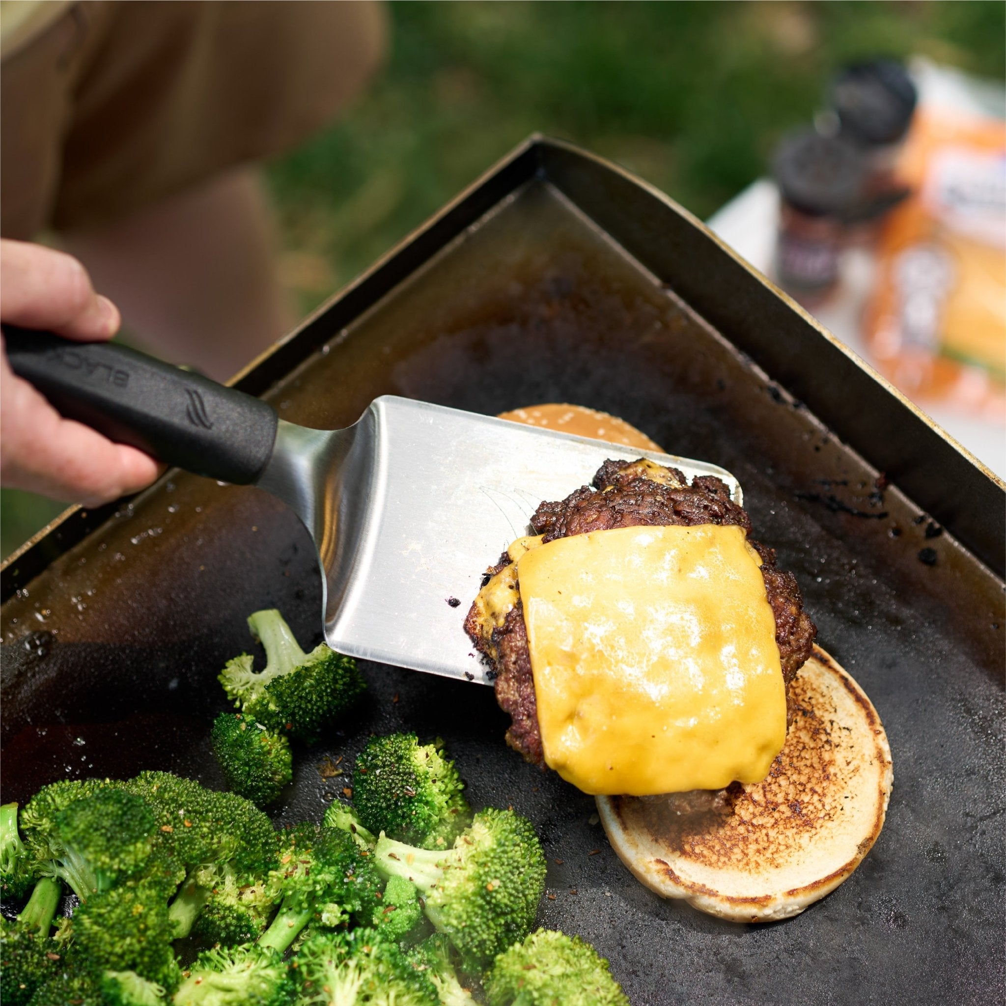 The burger spatula is perfect for flipping and serving juicy burgers. 