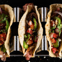 Overhead image of tacos sitting in the taco rack. 